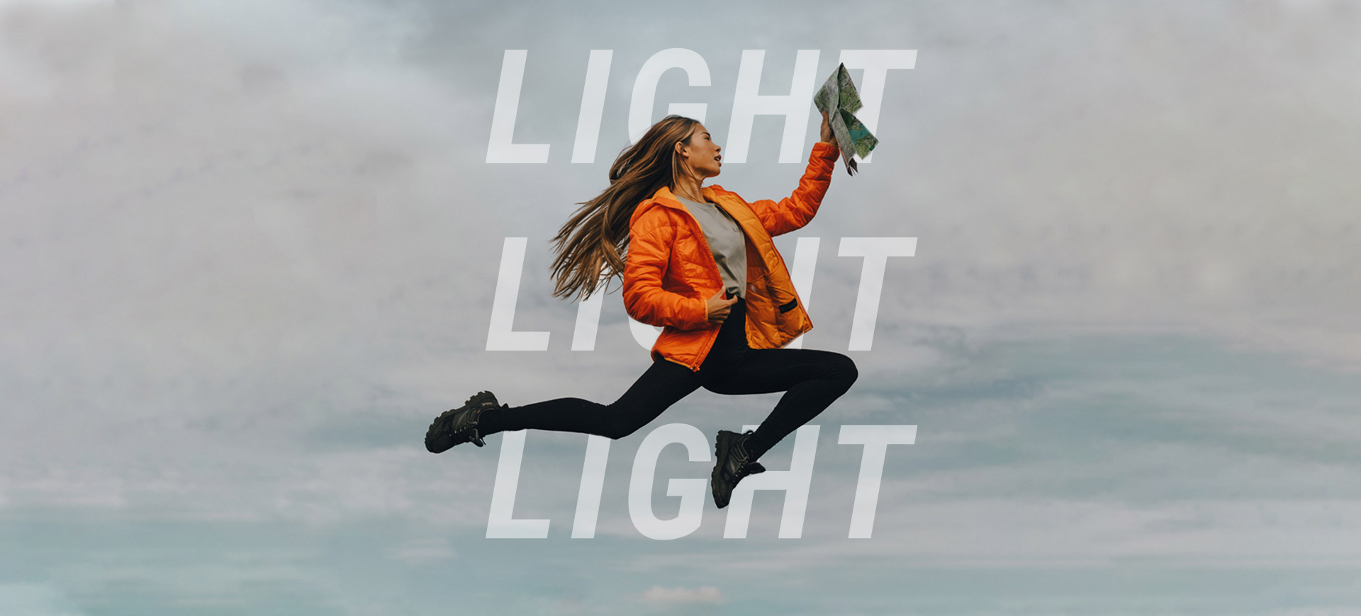 Woman in the air with card in hand