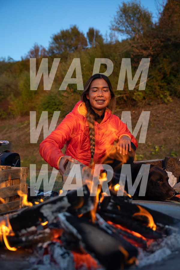 Woman at the campfire with winter jacket