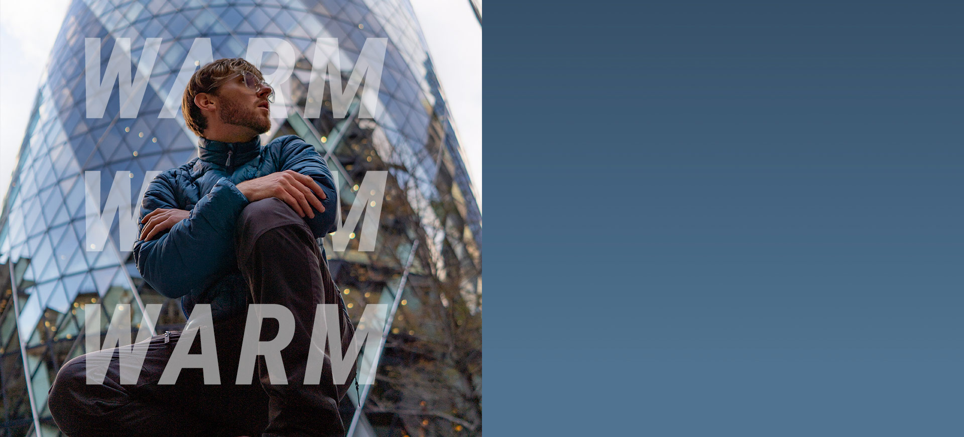 Man poses in front of building